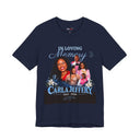 A navy blue short-sleeve t-shirt with a custom memorial graphic for 'Carla Jeffery' featuring family photos, the text 'IN LOVING Memory', and '1993 - 2026' on a white background.